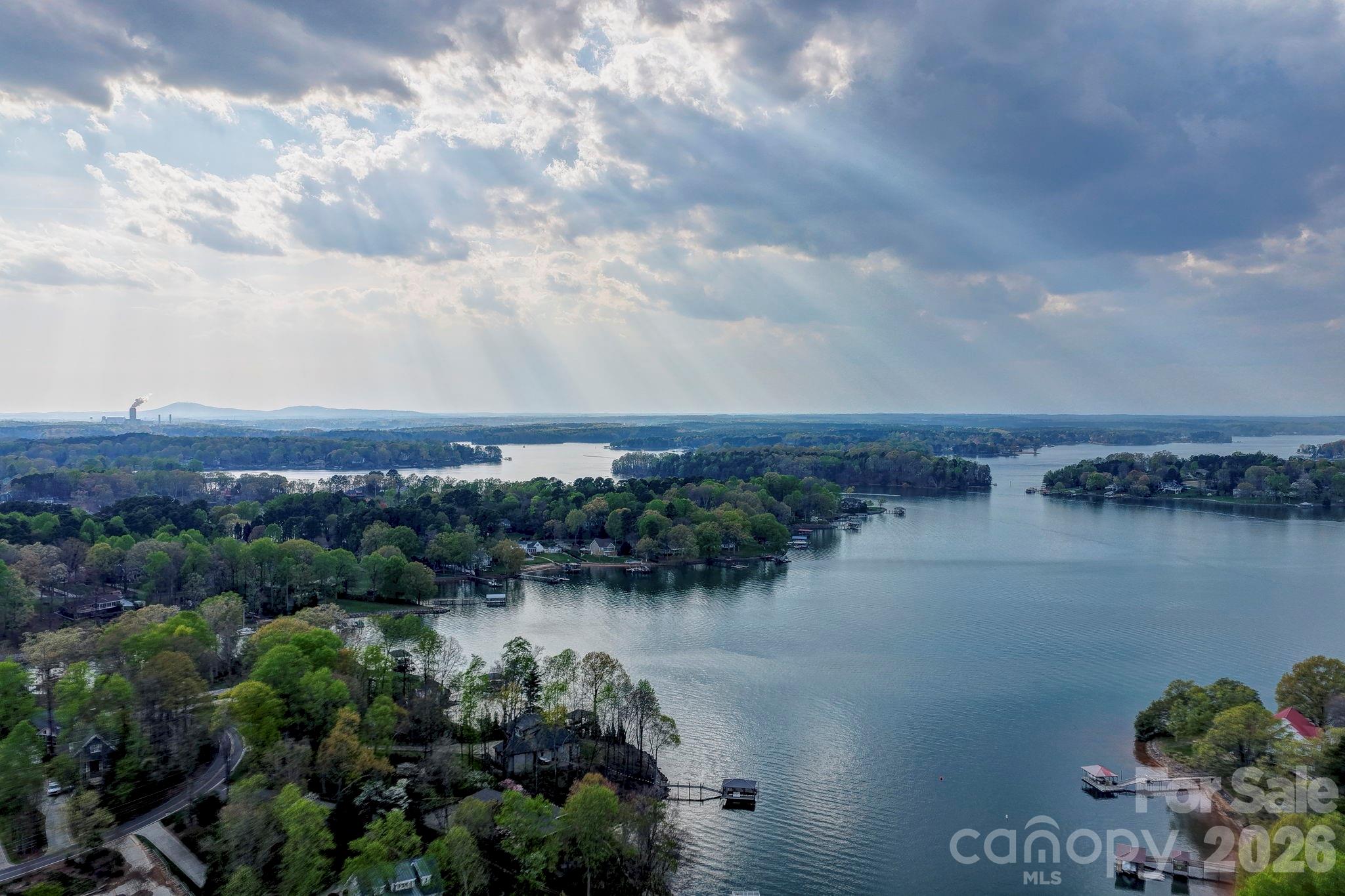 644 Normandy Road Mooresville, NC 28117 - Photo 24 of 32 a view of a lake with houses in the back