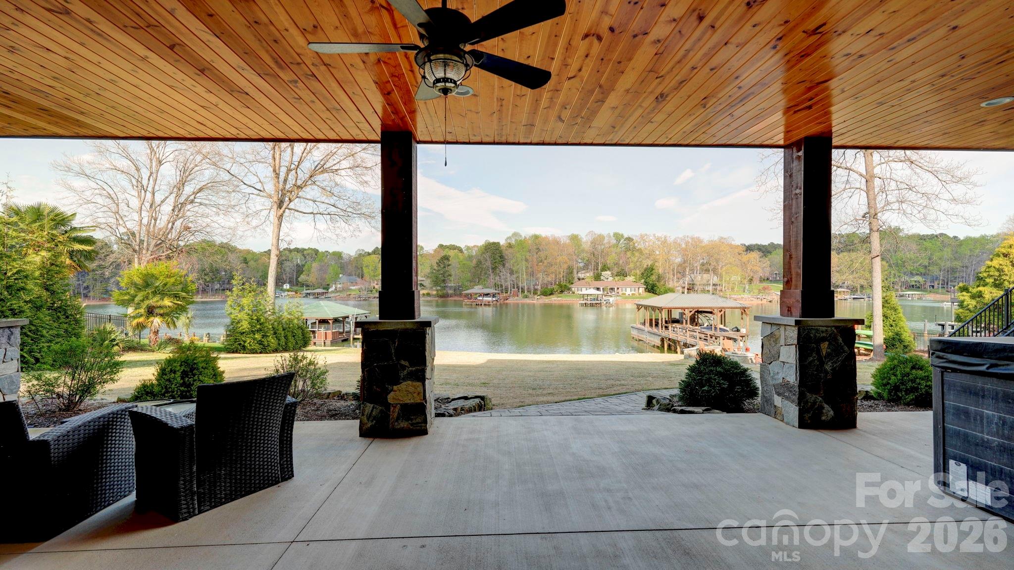 644 Normandy Road Mooresville, NC 28117 - Photo 26 of 32 a view of a patio with lake view and a floor to ceiling window