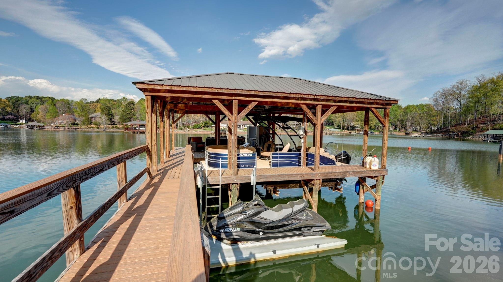 644 Normandy Road Mooresville, NC 28117 - Photo 30 of 32 a view of balcony with wooden floor and outdoor seating