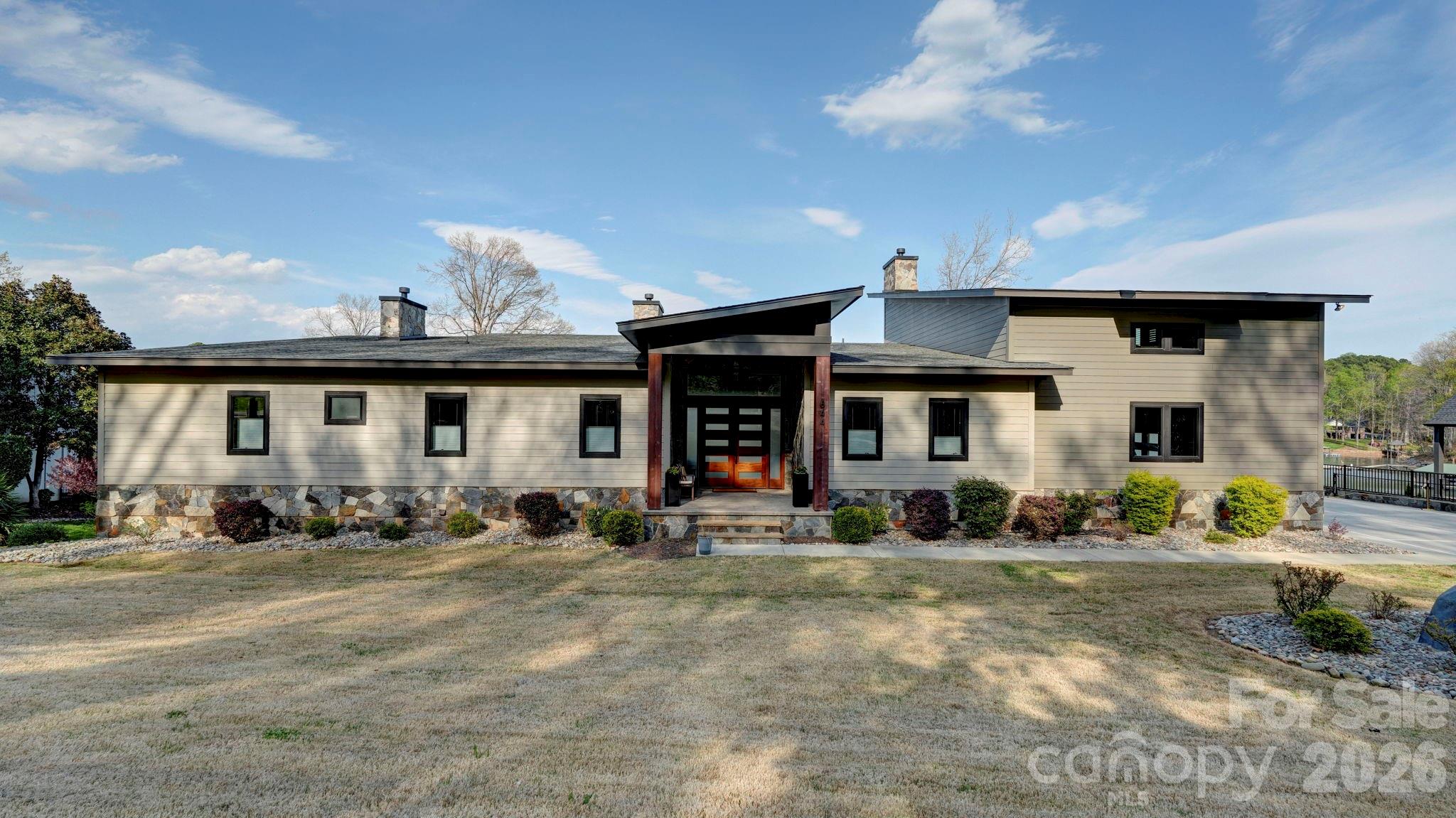 644 Normandy Road Mooresville, NC 28117 - Photo 4 of 32 a front view of a house with a outdoor space