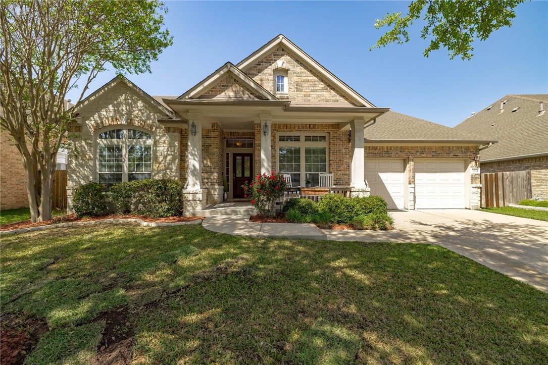 2022 Nelson Ranch Loop Cedar Park, TX 78613 - Photo 1 of 1 a front view of a house with garden
