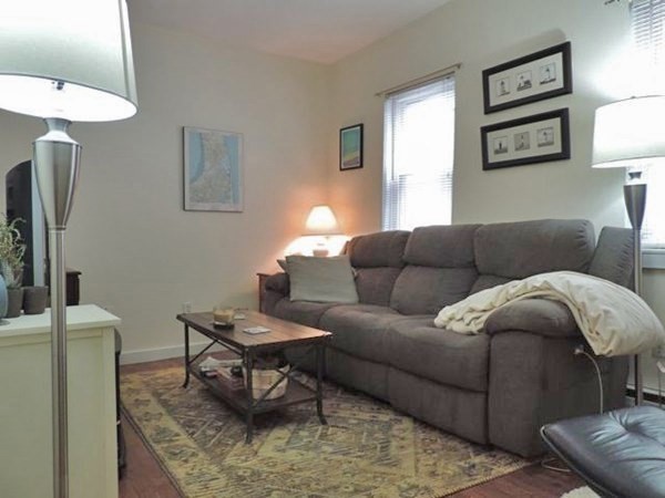 1-4 Schrepel Place Boston, MA 02127 - Photo 10 of 13 a living room with furniture and a couch