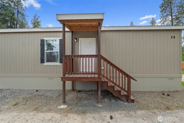 a view of a porch with a bench