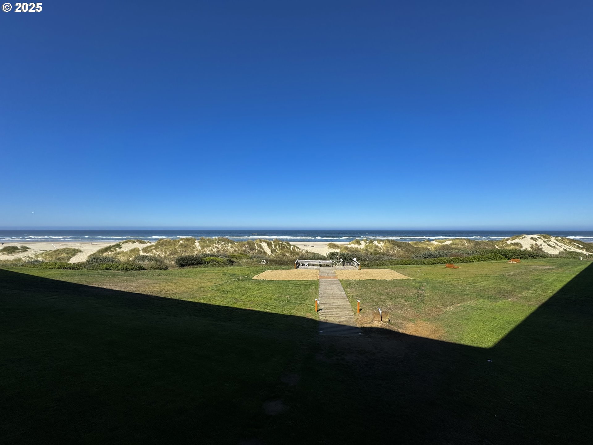 88416 1st Avenue, Unit 201 Florence, OR 97439 - Photo 11 of 29 a view of an ocean from a balcony
