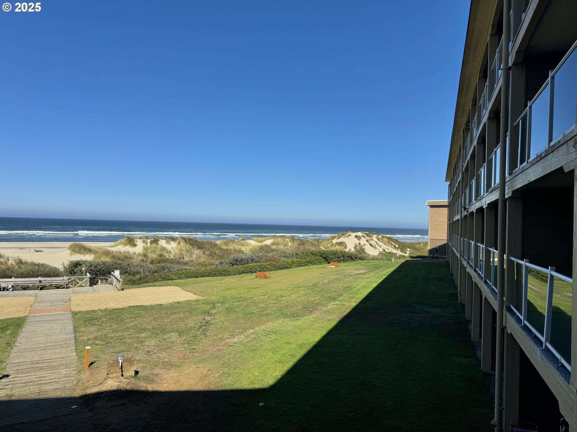 88416 1st Avenue, Unit 201 Florence, OR 97439 - Photo 14 of 29 a view of an ocean from a balcony