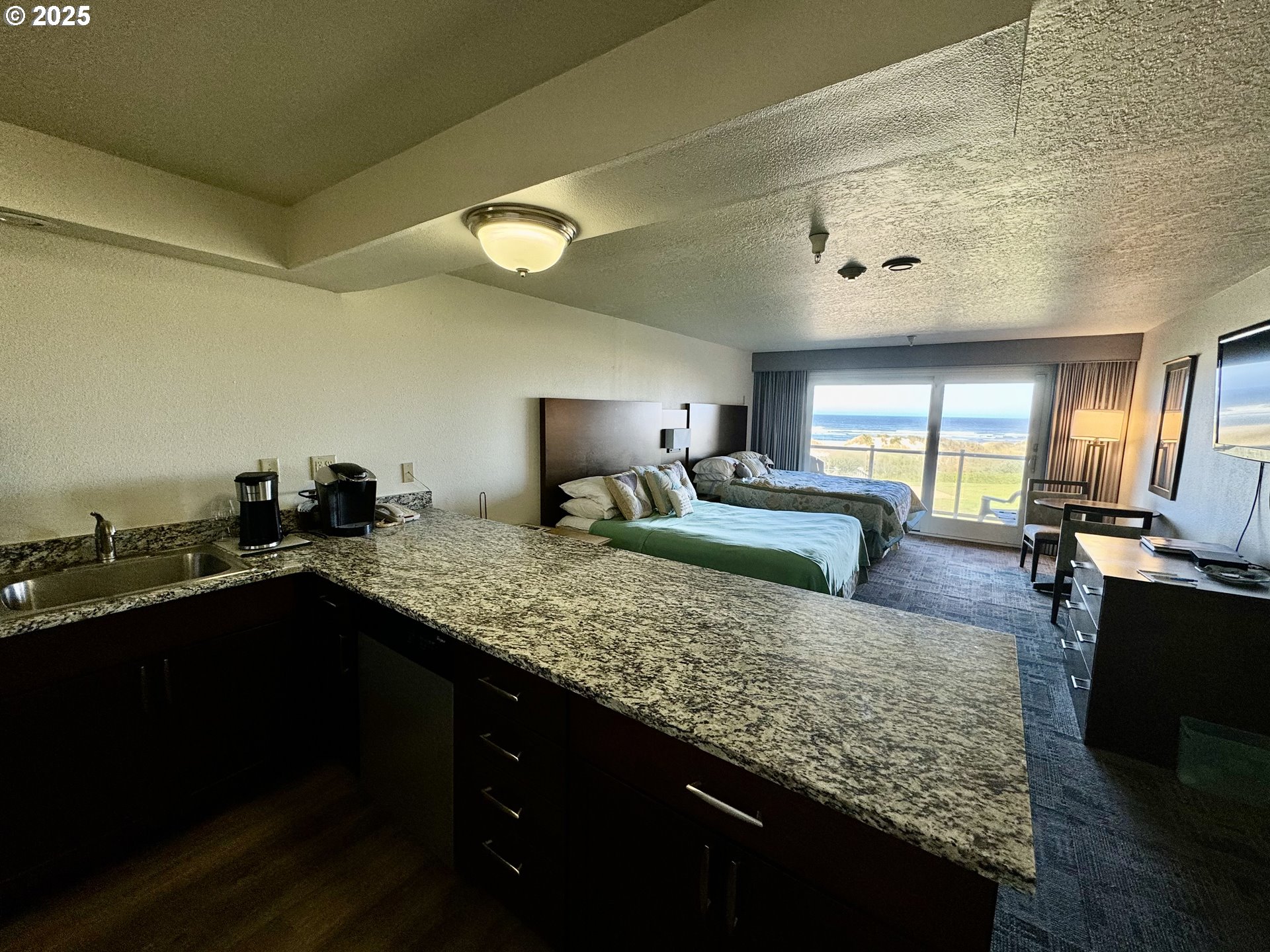 88416 1st Avenue, Unit 201 Florence, OR 97439 - Photo 4 of 29 a kitchen with counter top space and sink