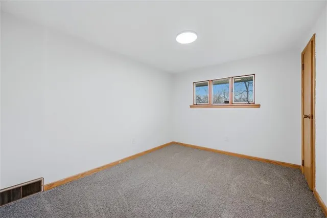 a bathroom with a sink a toilet a mirror and bathtub