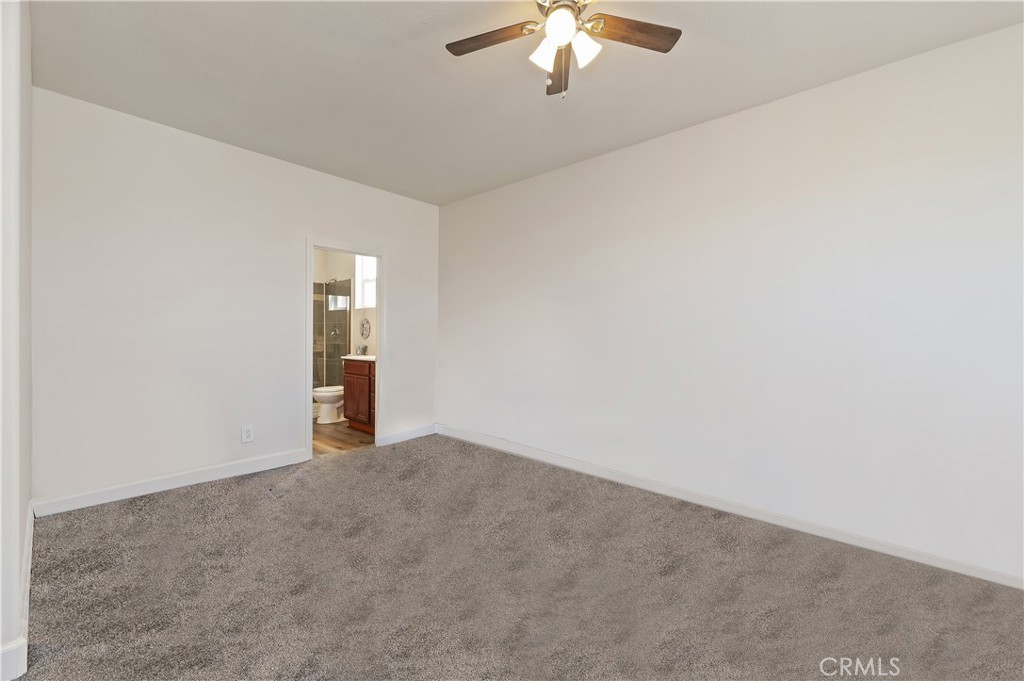 31244 Locust Court Temecula, CA 92592 - Photo 18 of 30 an empty room with chandelier fan