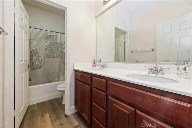 a bathroom with a sink a toilet and a bathtub