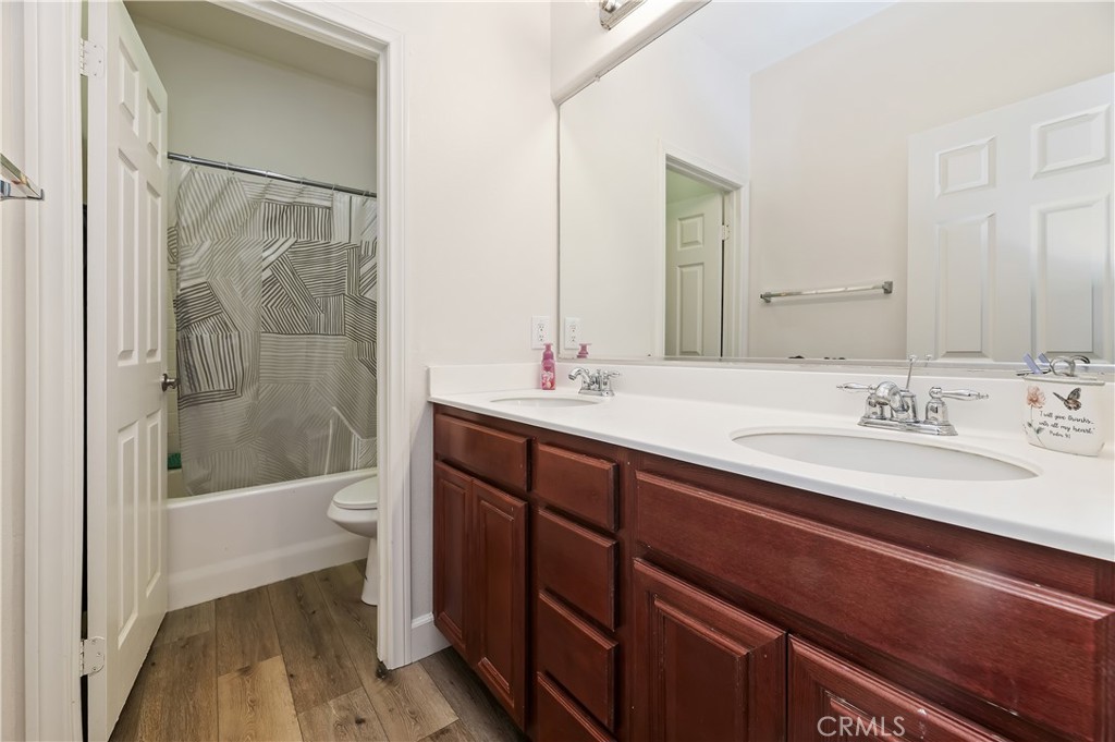 31244 Locust Court Temecula, CA 92592 - Photo 22 of 30 a bathroom with a sink a toilet and a bathtub