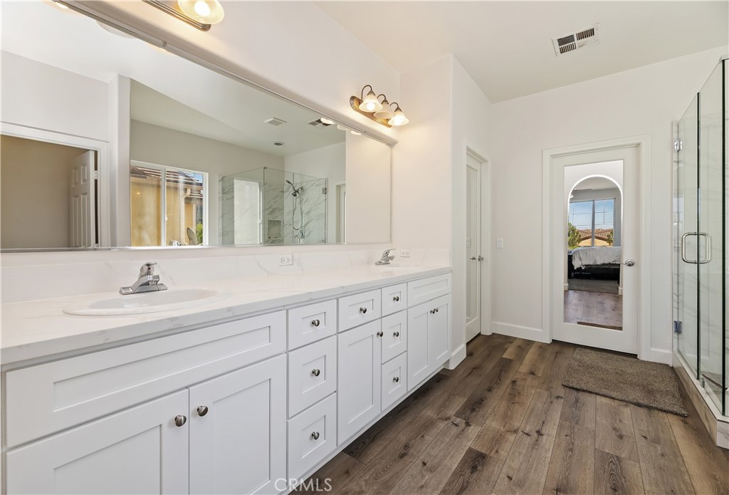 31244 Locust Court Temecula, CA 92592 - Photo 26 of 30 a spacious bathroom with double sink and a large mirror