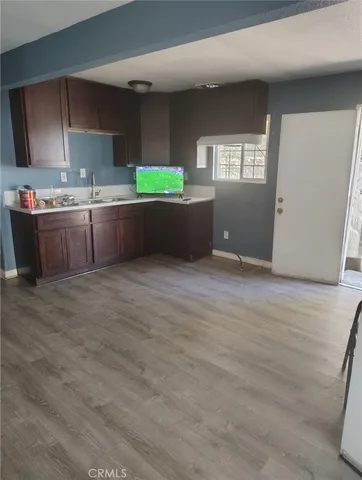 a kitchen with stainless steel appliances kitchen island granite countertop a sink counter space and cabinets