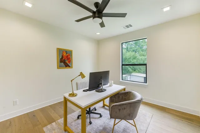 a workspace with furniture and a window