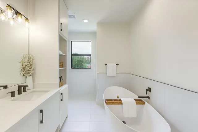 a bathroom with a sink a toilet and tub