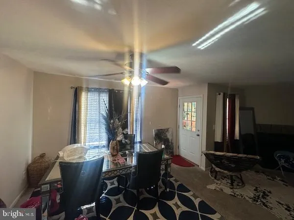 a room with lots of chairs and mirrors