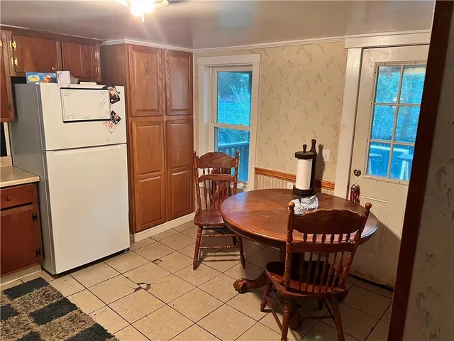 a dining room with furniture and window