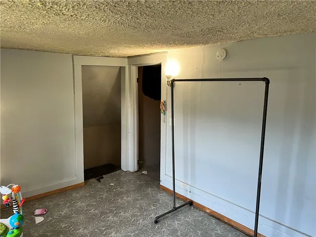 a front view of a house with a garden and deck