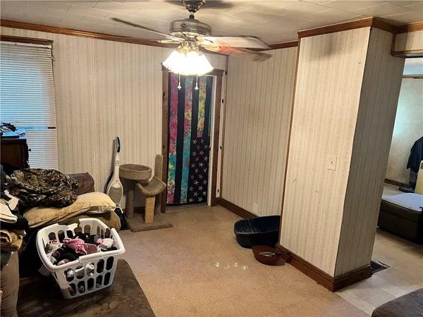 a bedroom with furniture and a chandelier