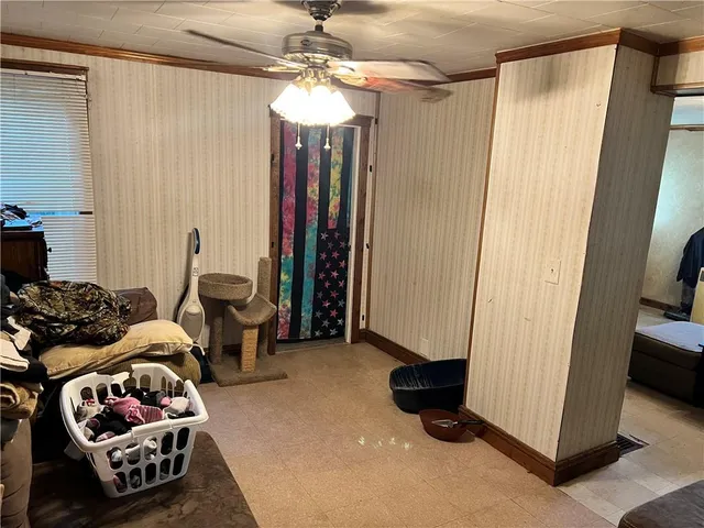 a bedroom with furniture and a chandelier