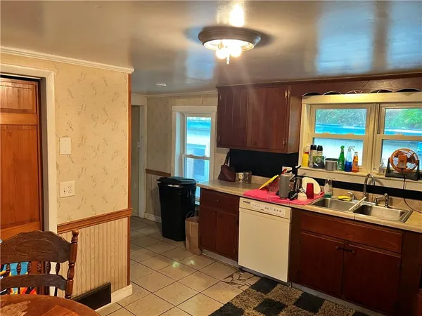 a kitchen with a sink and cabinets