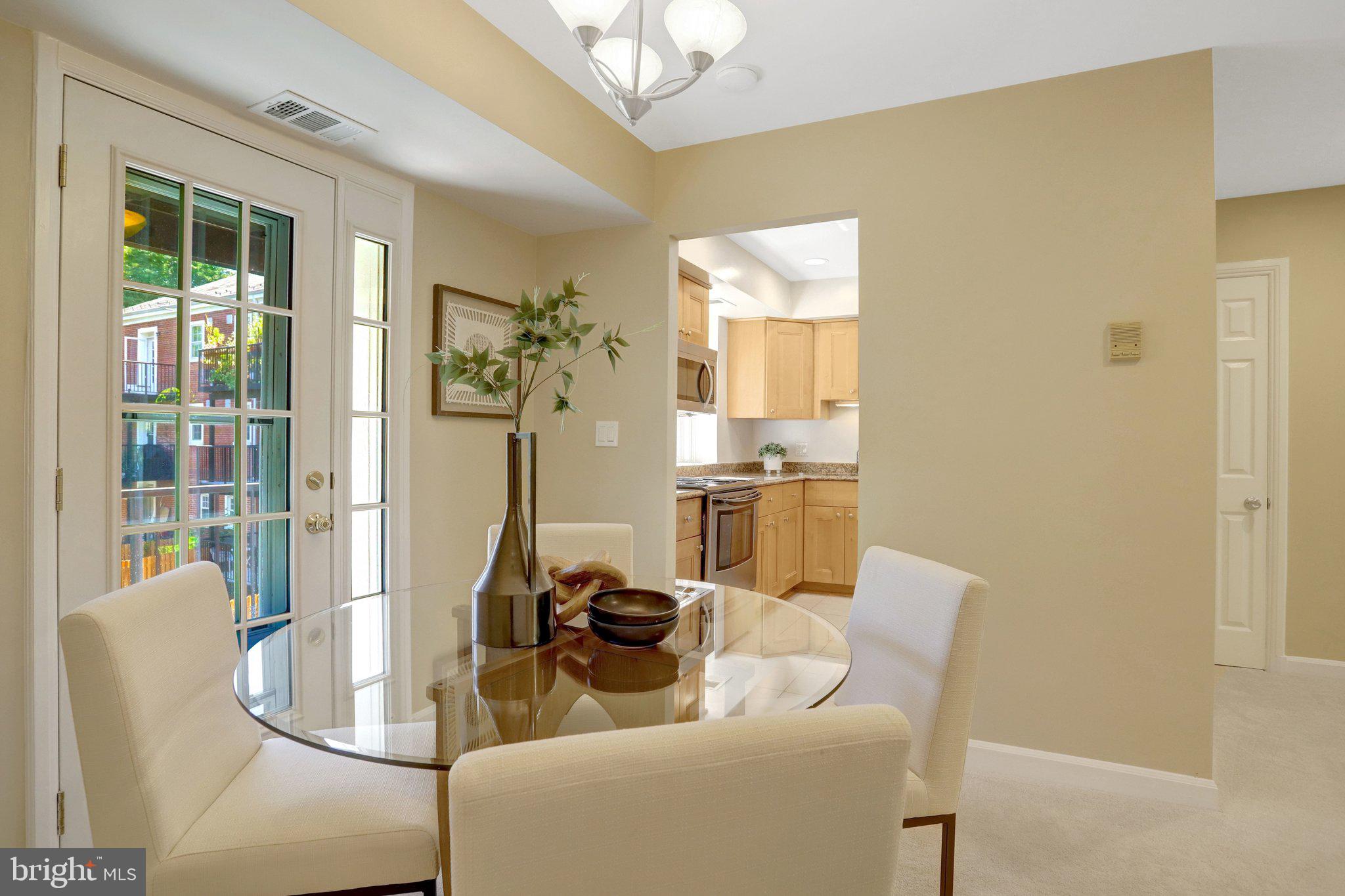 4900 29th Road South, Unit B1 Arlington, VA 22206 - Photo 6 of 56 Dining area with glass door to the private balcony