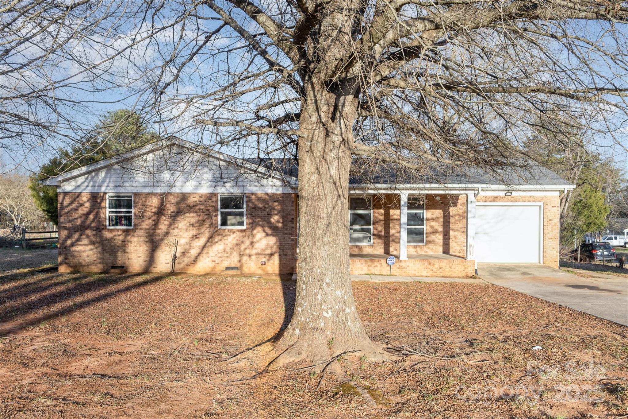 2888 Robinson Road Newton, NC 28658 - Photo 1 of 26 a view of a backyard with a large tree