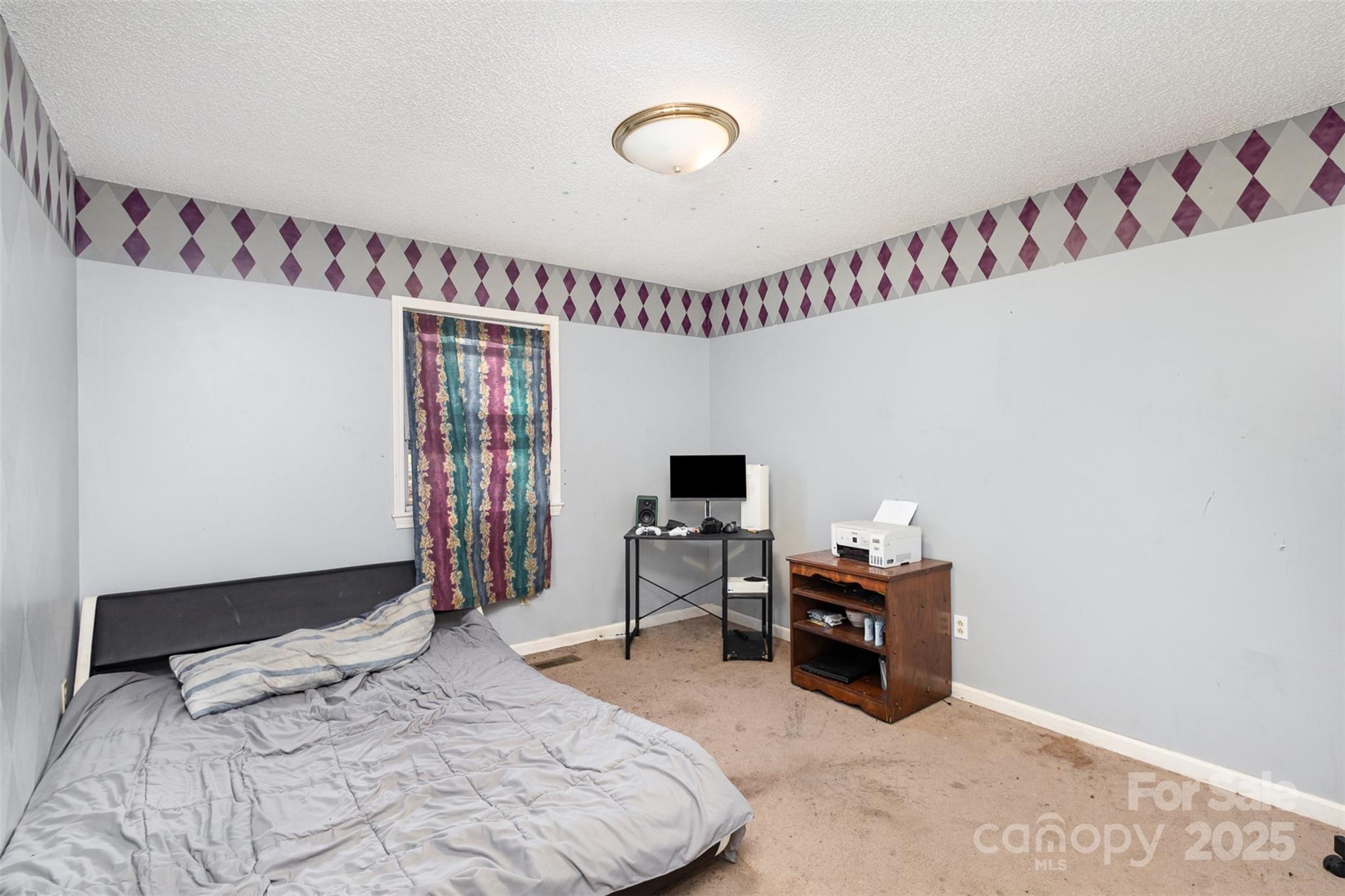 2888 Robinson Road Newton, NC 28658 - Photo 21 of 26 a bedroom with a bed and a flat screen tv