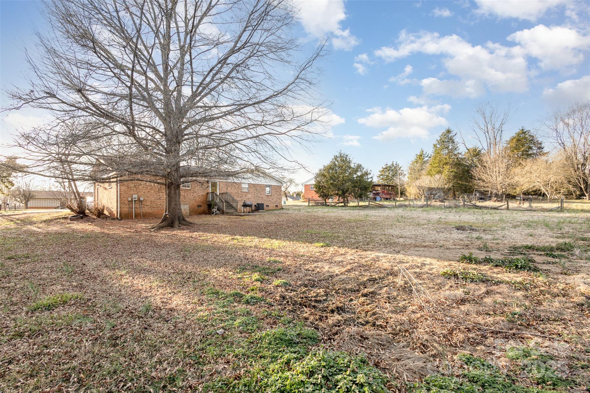 2888 Robinson Road Newton, NC 28658 - Photo 25 of 26 a view of dirt yard with a large tree