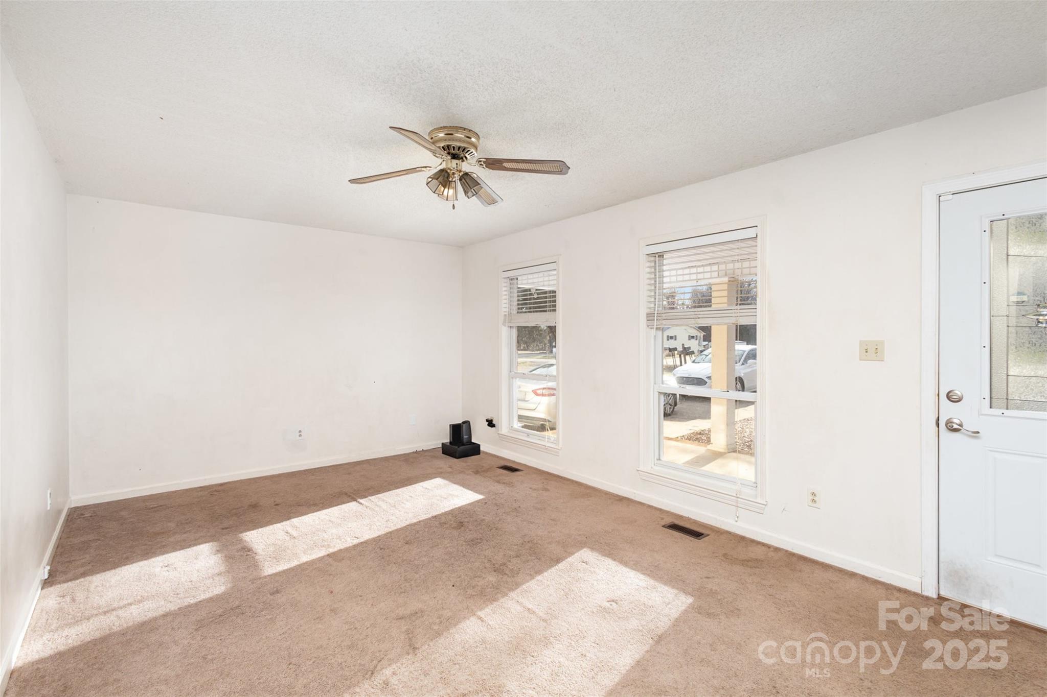 2888 Robinson Road Newton, NC 28658 - Photo 6 of 26 a view of empty room with windows