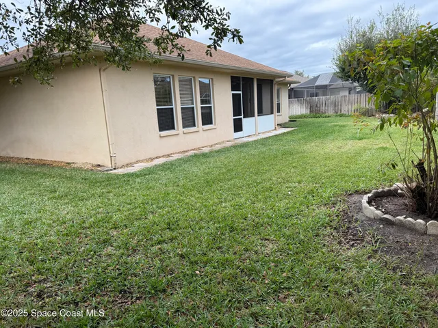 a backyard of a house with lots of green space