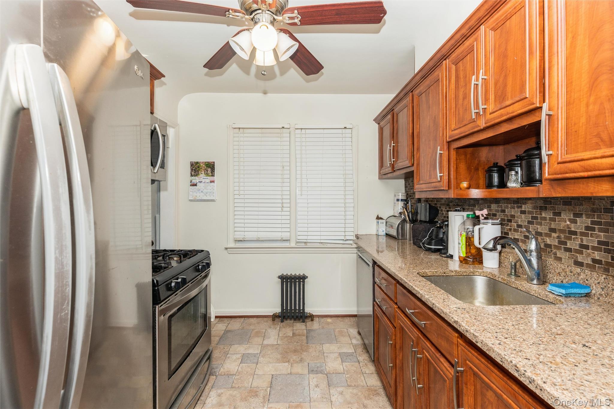 6 Jasper Street Valley Stream, NY 11580 - Photo 6 of 19 a kitchen with stainless steel appliances granite countertop a sink refrigerator and cabinets