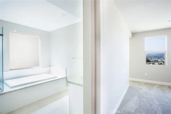 a bathroom with a bathtub and a sink