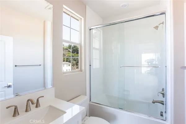 a view of a white building with many windows