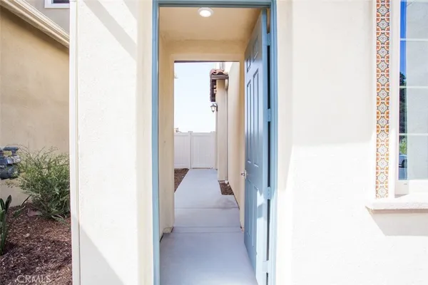a view of a bathroom from a corridor