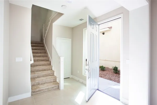 a view of a hallway view with staircase