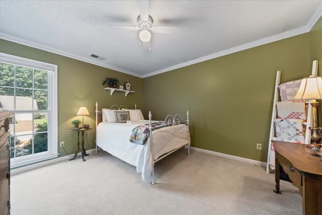 a bed room with a bed and a chandelier