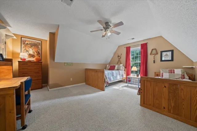 a view of a livingroom with furniture and cabinet