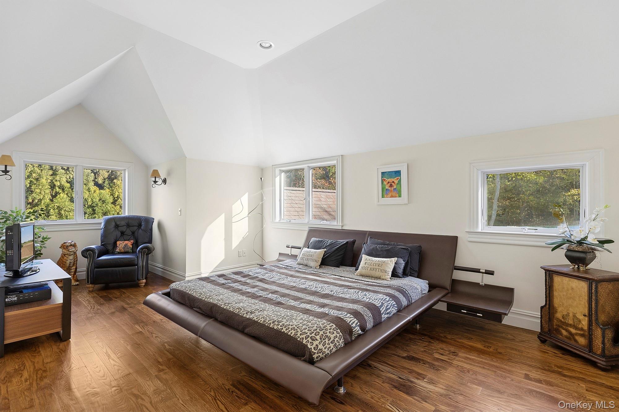 144 Round Swamp Road West Hills, NY 11743 - Photo 30 of 39 Bedroom featuring vaulted ceiling, dark wood finished floors, baseboard heating, and recessed lighting