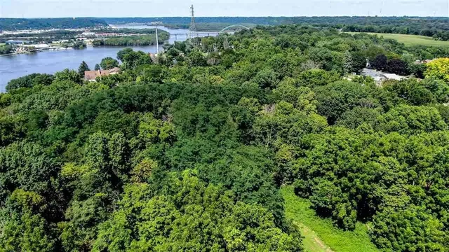 an aerial view of a houses with a lake view