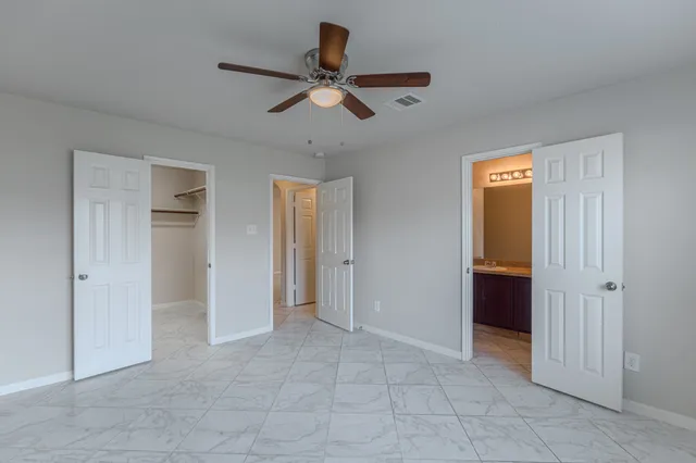 a view of an empty room and closet area