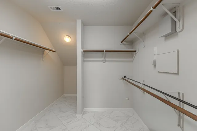 a view of an empty walk in closet