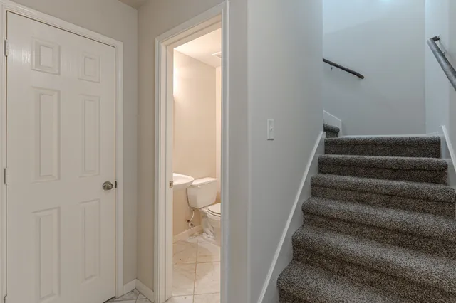a view of entryway and bedroom with a bathtub