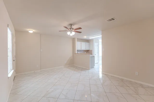 a view of a kitchen with a sink and a window