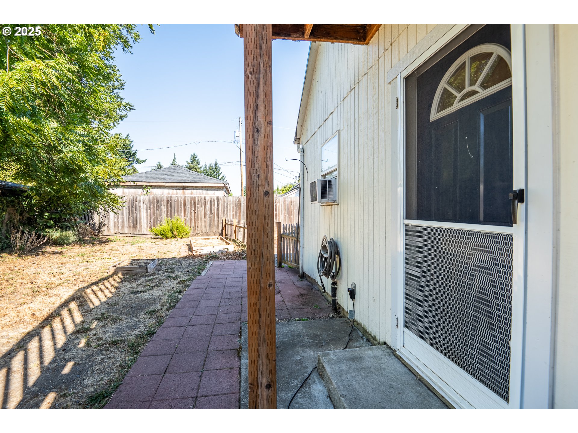 1525 Park Avenue Eugene, OR 97404 - Photo 22 of 36 a view of a porch with wooden floor and a yard