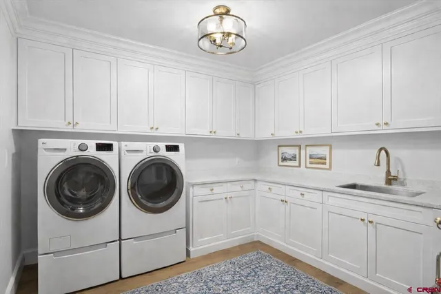 a view of a kitchen with cabinets dryer and washer