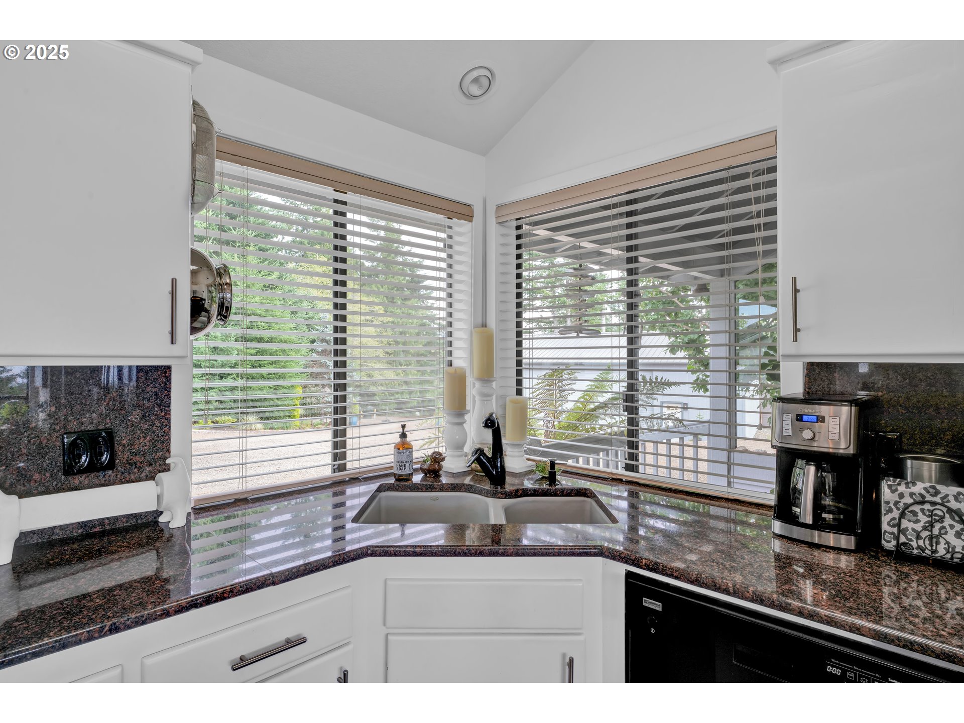 88616 Ocean View Lane Florence, OR 97439 - Photo 16 of 47 a kitchen with granite countertop a sink and a window