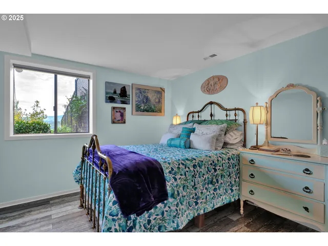 a bedroom with a bed and a dresser