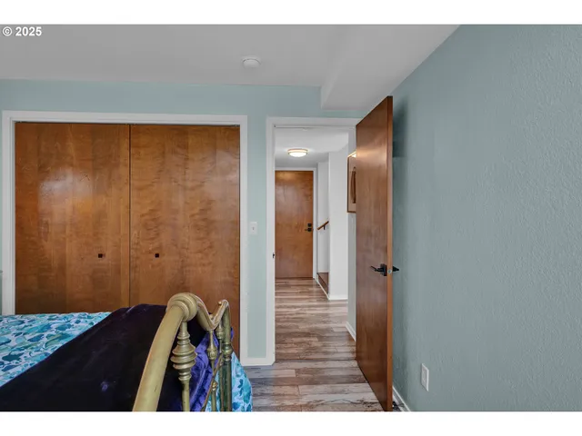 a view of hallway with wooden floor