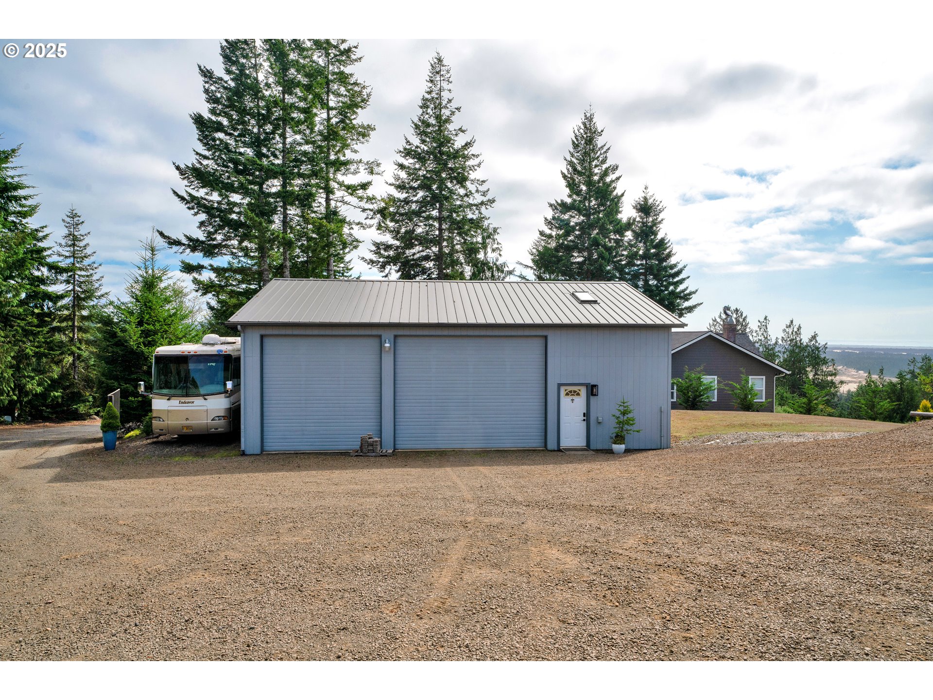 88616 Ocean View Lane Florence, OR 97439 - Photo 45 of 47 a view of a house with a garage