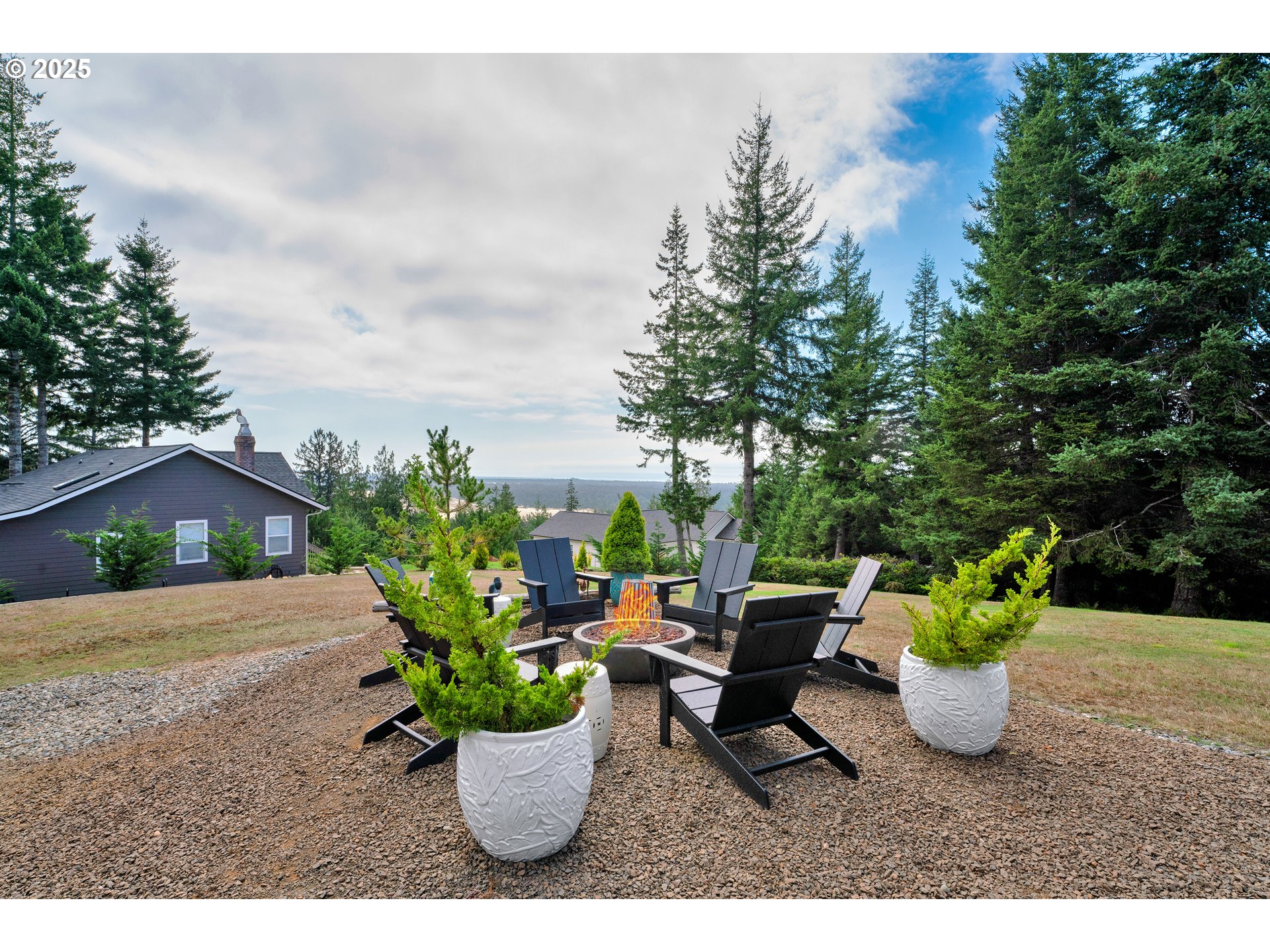 88616 Ocean View Lane Florence, OR 97439 - Photo 46 of 47 a view of a porch with furniture and a garden